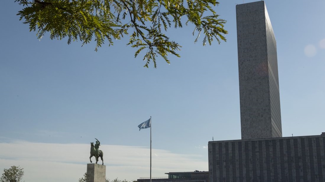 A view of the General Assembly and Secretariat buildings at UN Headquarters, as well as the equestrian statue symbolizing Peace.